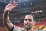 Melbourne Storm captain Cameron Smith waves as he leaves the Suncorp Stadium turf after an NRL game against Brisbane Broncos.