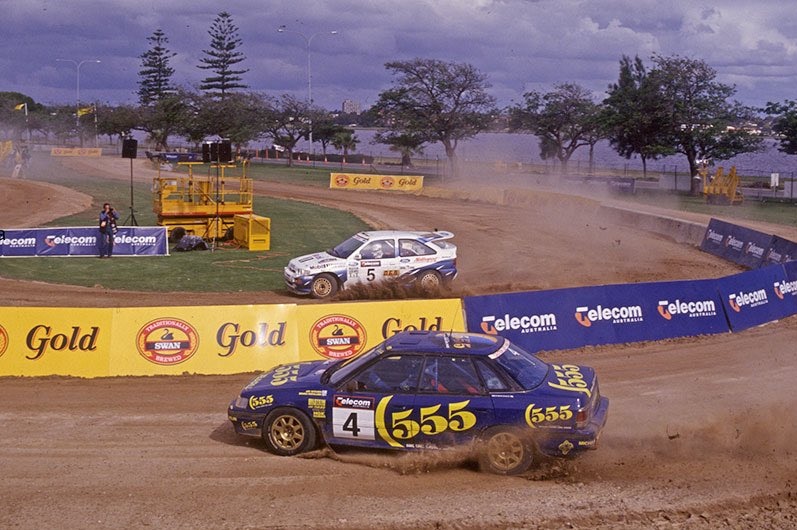 Cars race around a track during a Rally Australia event at Langley Park, Perth in 1993