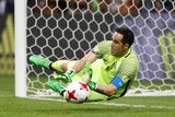 Chile's Claudio Bravo saves from Portugal's Nani to win the penalty shootout in the Confederations Cup semi-final.