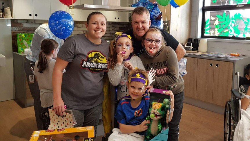 Jett Burgess with his family at the Sydney Children's Hospital.