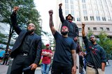 People gather in protest against the police shooting of Keith Scott