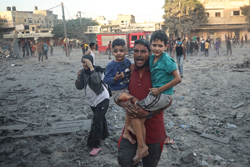 Palestinian family reacts following Israeli airstrike