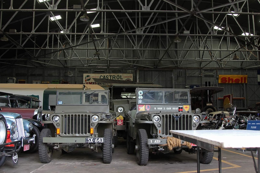 The interior of the MVEC hangar, with the fortified hangar and some vintage vehicles visible.