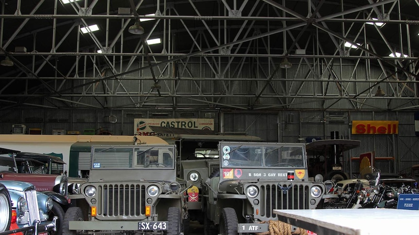 The interior of the MVEC hangar, with the fortified hangar and some vintage vehicles visible.