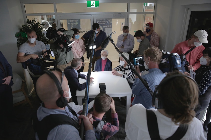 Cameras surround anthony albanese at a election campaign 