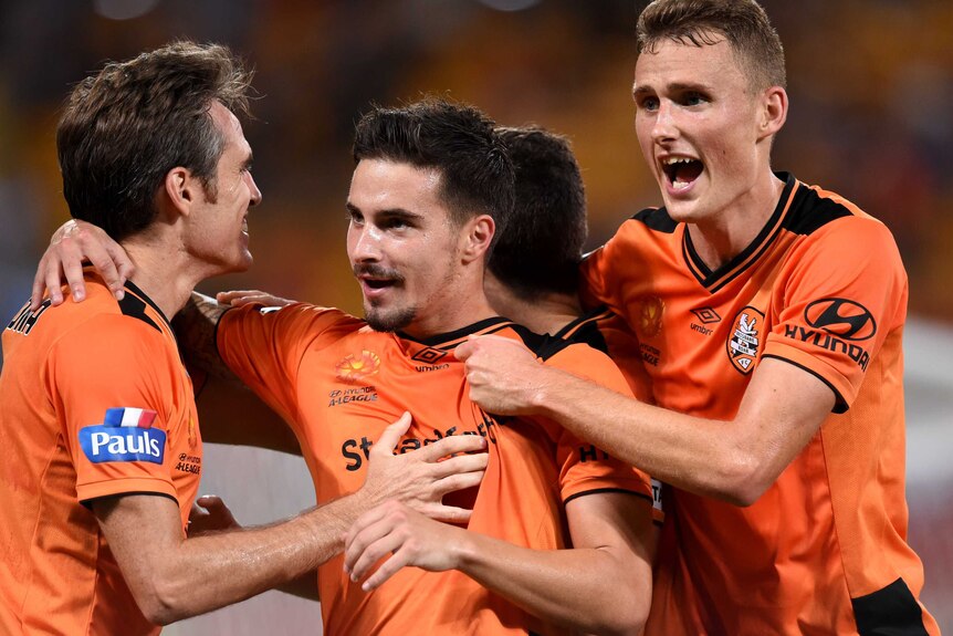 Jamie McLaren celebrates a goal for Brisbane Roar