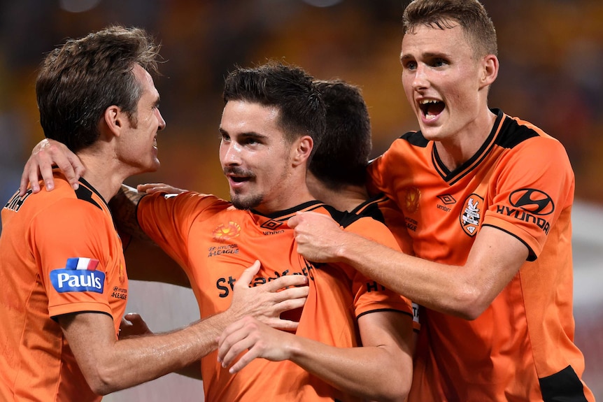 Jamie Maclaren celebrates a goal for Brisbane Roar