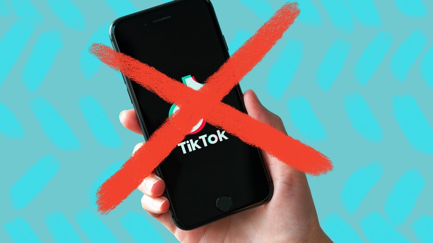 A hand holding a phone with the TikTok logo on it. An illustrated cross mark over the phone.
