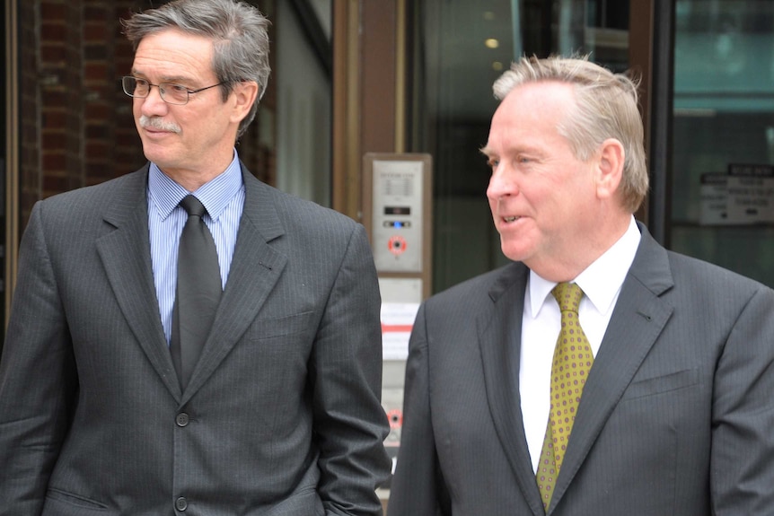 WA Premier Colin Barnett and then-energy minister Mike Nahan walking side by side.