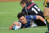 The Brumbies' Matt Toomua scores his side's third try against the Sharks in Durban.