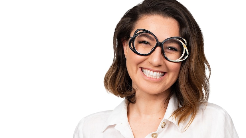 A profile image of a woman with dark, shoulder-length hair, wearing glasses.