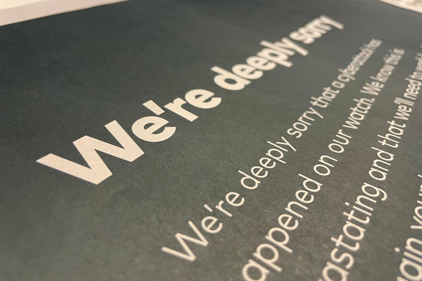 Optus's full page ad in a newspaper, which says "we're deeply sorry"