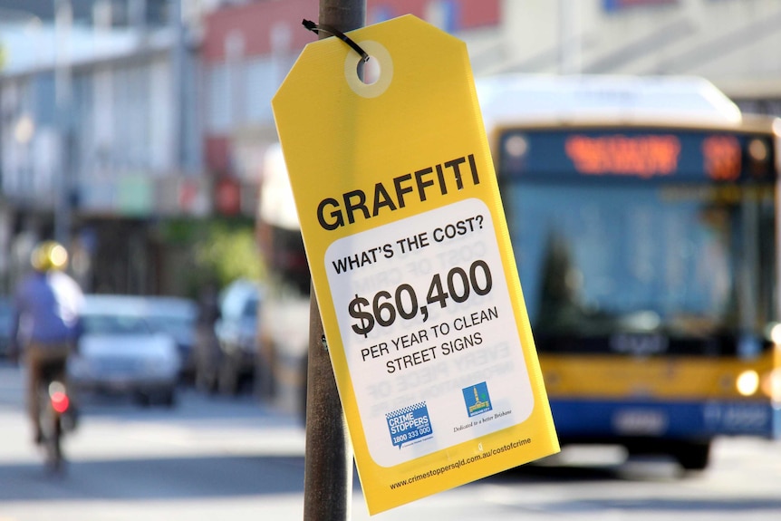 One of the graffiti 'price tags' hanging from Brisbane City Council assets in Brisbane's West End.