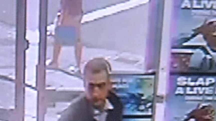 All bets off ... CCTV footage shows a man entering the Beaconsfield TAB.