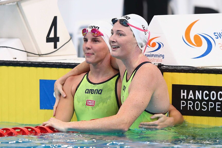 Cate Campbell celebrates 100m freestyle win with sister Bronte