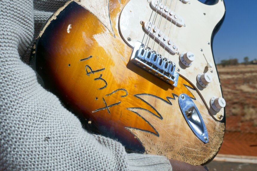 A close-up shot of a guitar.