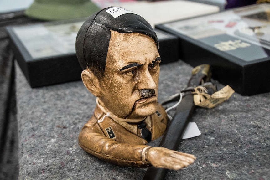 A small figurine of German dictator Adolf Hitler.