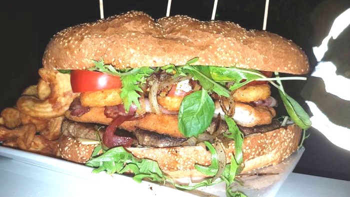 A gigantic hamburger, weighing in at 2.5kg, sits on a plate in a pub in Southern Cross, Western Australia.