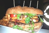 A gigantic hamburger, weighing in at 2.5kg, sits on a plate in a pub in Southern Cross, Western Australia.