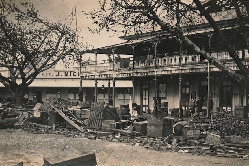 A hotel with debris scattered at the front