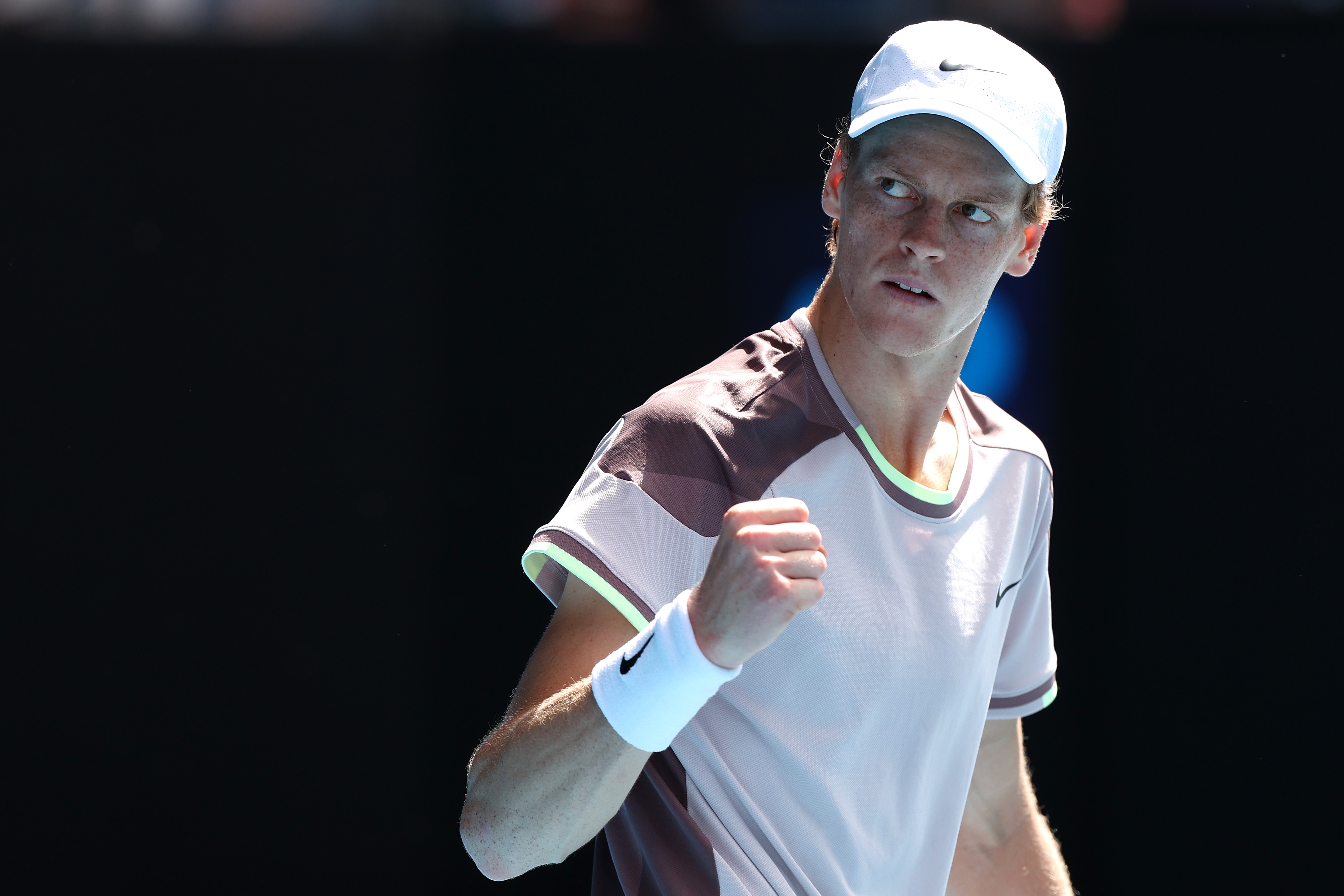Jannik Sinner pumps his fist during 2024 Australian Open semifinal.