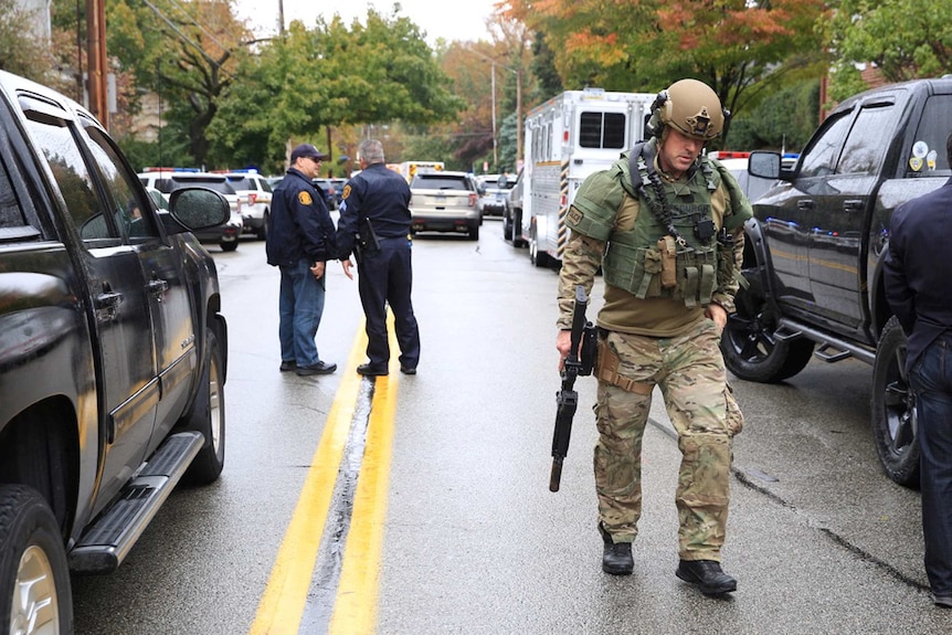 police officers stand in the middle of a road