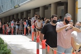 Queue of people at the vaccination hub at Brisbane Convention and Exhibition Centre.