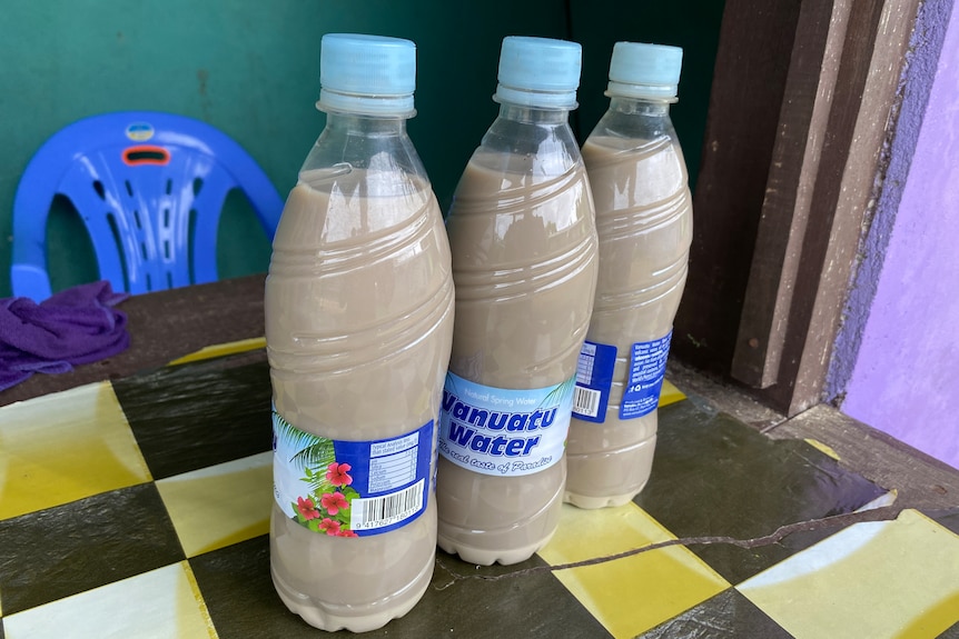Three bottles full of kava for sale at a kava bar on Santo island, Vanuatu.