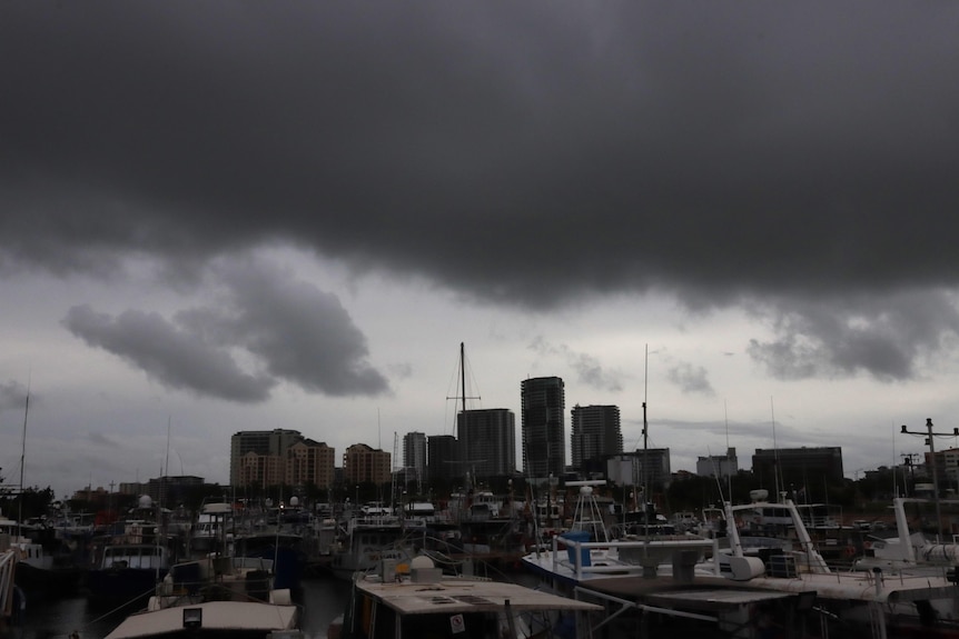 A large, dark and ominous cloud hangs over the Darwin skyline