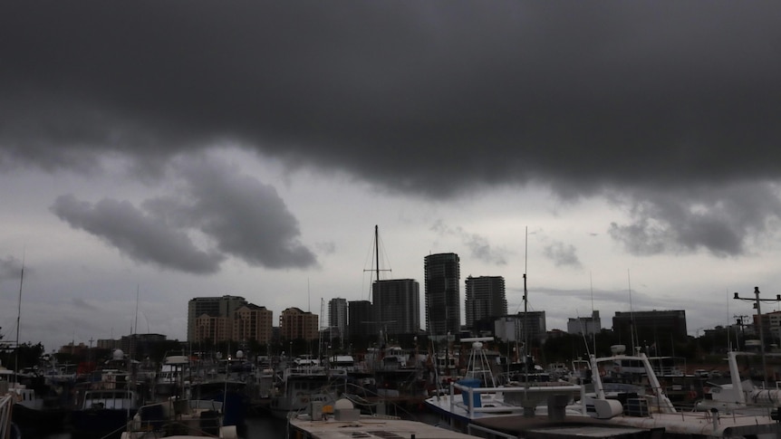 A large, dark and ominous cloud hangs over the Darwin skyline