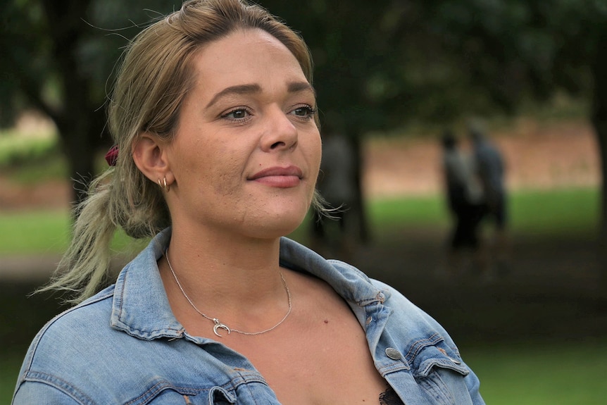 A woman wearing a blue shirt