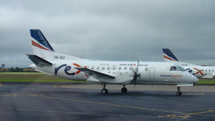 A rex aircraft on the tarmac.