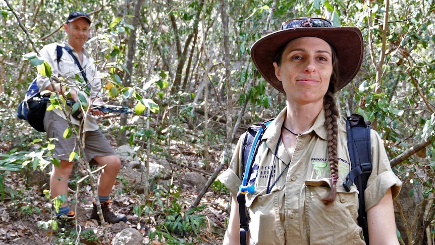 Snake researcher Christina Zdenek and herpetologist Chris Hay stand in the bush on Magnetic Island