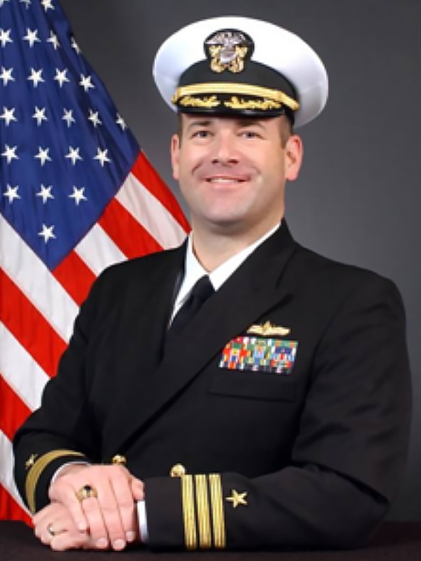 Official photo of a Naval officer in uniform.