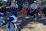 School children dance in Indonesian costume