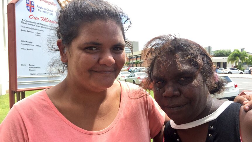Elizabeth Kulla Kulla (right) stands with another woman in Cairns outside a church after meeting Prince Charles.