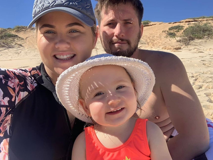 A selfie shot of Cleo Smith flanked by mother Ellie Smith and stepfather Jake Gliddon at the beach.
