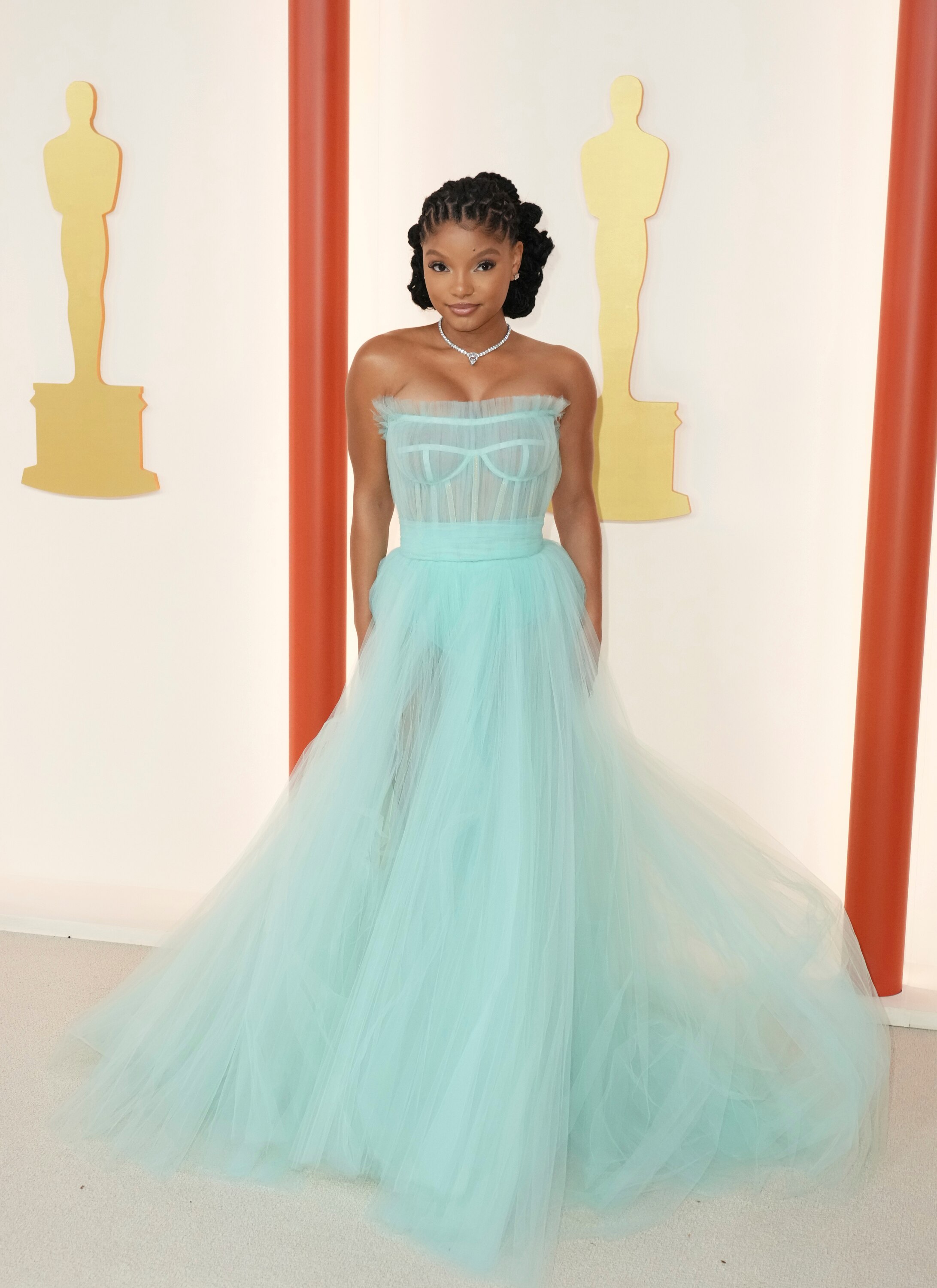 Halle Bailey wearing a pale blue tulle strapless gown with a full floor-length skirt and coreset-like boning