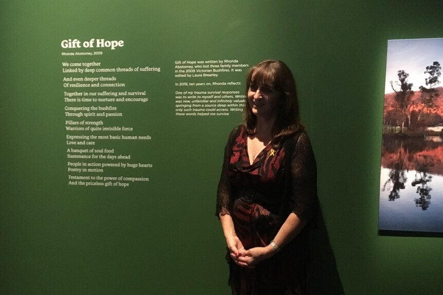 Rhonda Abotomey with her poetry on display at the Melbourne Museum.