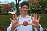 James Fennamore holds up 10 fingers and a cricket ball to celebrate his rare feat of dismissing an entire team