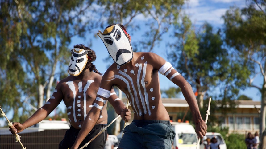 Two male Aboriginal dancers perform in Roebourne, WA