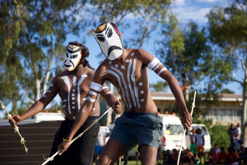 Two male Aboriginal dancers perform in Roebourne, WA