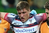 Rebels Sean McMahon helped off the field after being injured against the Chiefs at AAMI Park.