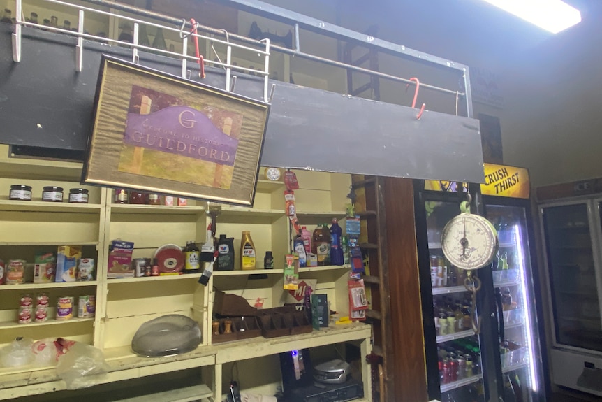 a photo of old things inside a general store showing things on shelves 