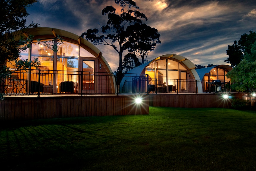 Exterior of accommodation units at night.