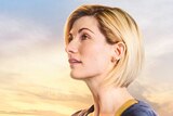Jodie Whittaker as the Doctor looks off to the left of the screen.