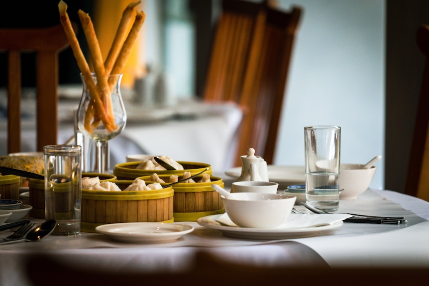 A photo of dumplings and porcelain on a dining table in Melbourne's Chinatown.