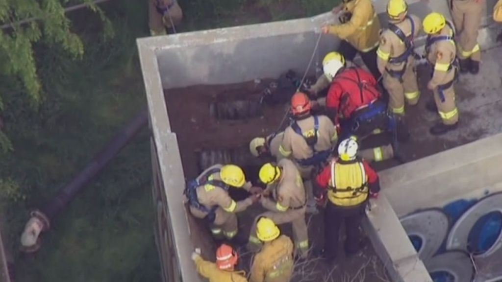 Rescue workers use camera to find boy alive after 12 hours in sewerage ...