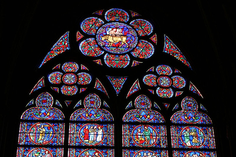 Stained glass window inside Notre Dame cathedral.