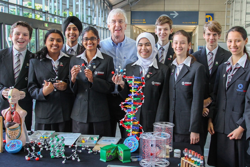 Students and Queensland Chief Scientist Geoff Garnett ahead of the record attempt in Brisbane.